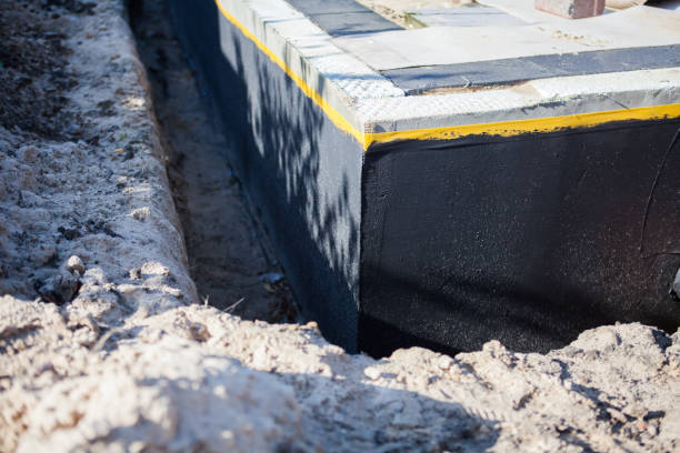 Professional Waterproofing technician working in Russiaville, IN